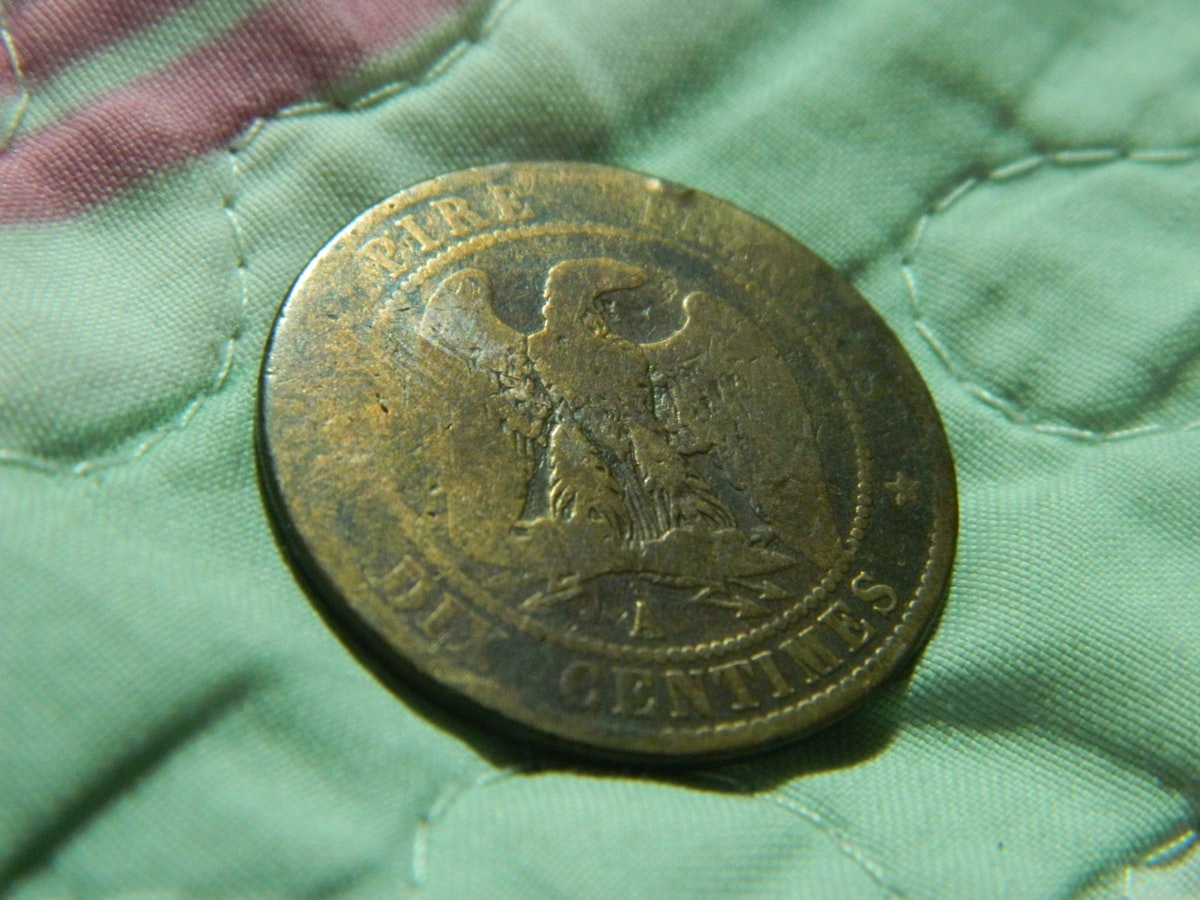 A coin displayed on a velvet surface — proper lighting and a soft background are essential tools for evaluating the strike quality and surface preservation that affect Mercury dime values