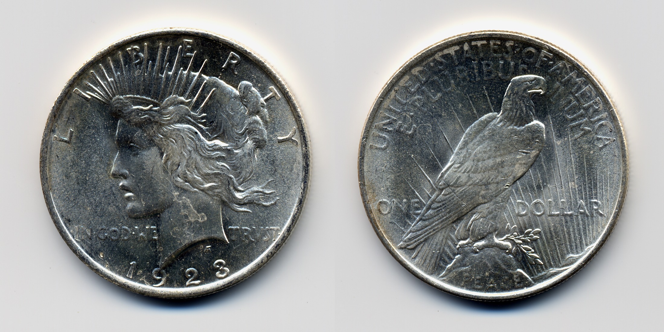 Obverse and reverse of a 1928 Peace dollar — the lowest-mintage date in the series at just 360,649 coins, the 1928-P is the key date that every Peace dollar collector needs