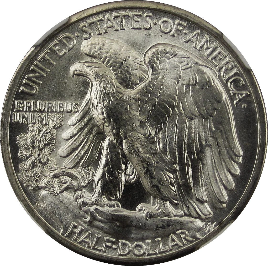 Reverse of a Walking Liberty half dollar — the eagle perched on a rocky crag with a pine sapling symbolizes America's strength and growth